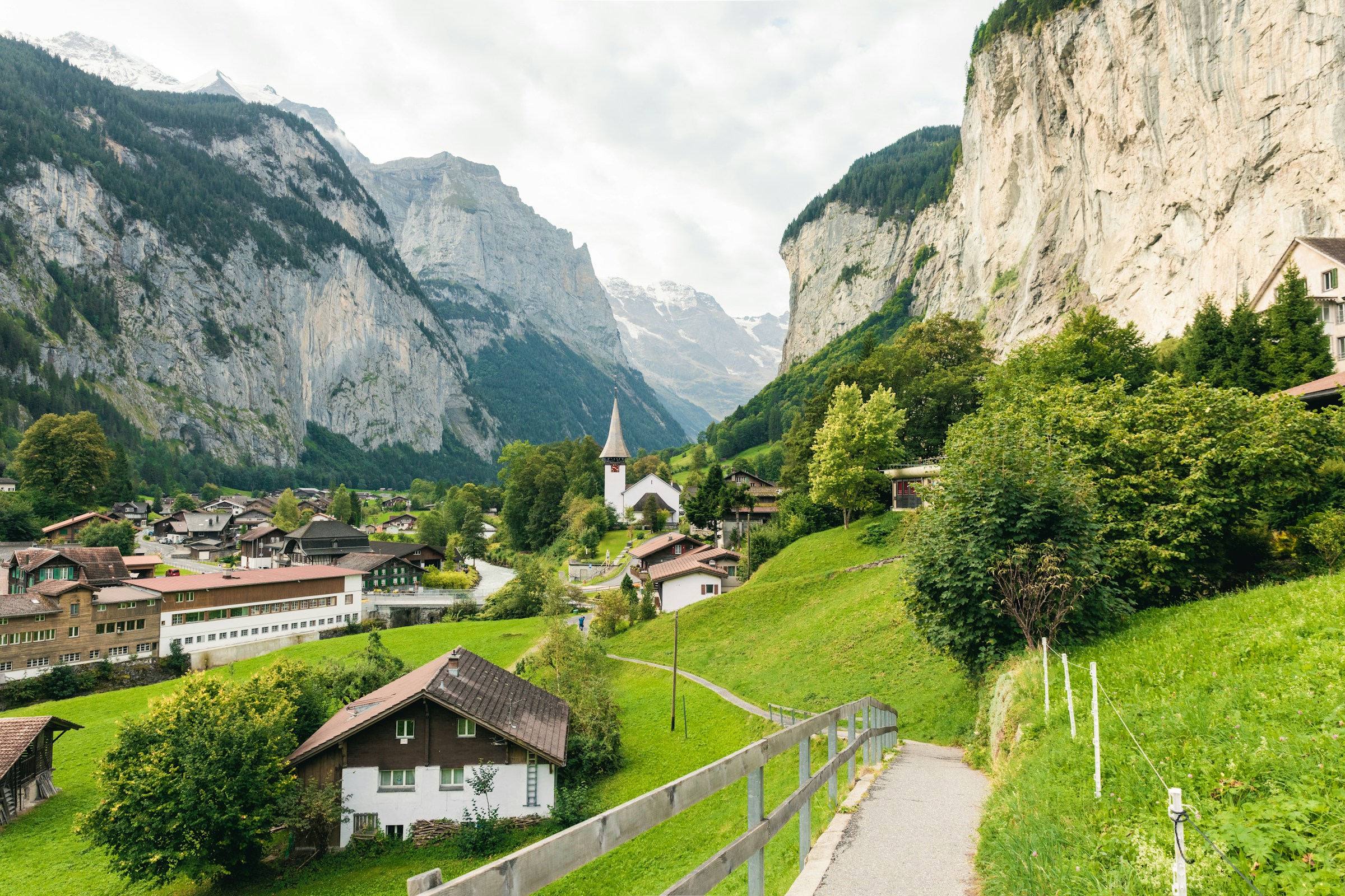 Swiss Alps: traditional alpine village and peaks—illustrative of discreet alpine programmes.